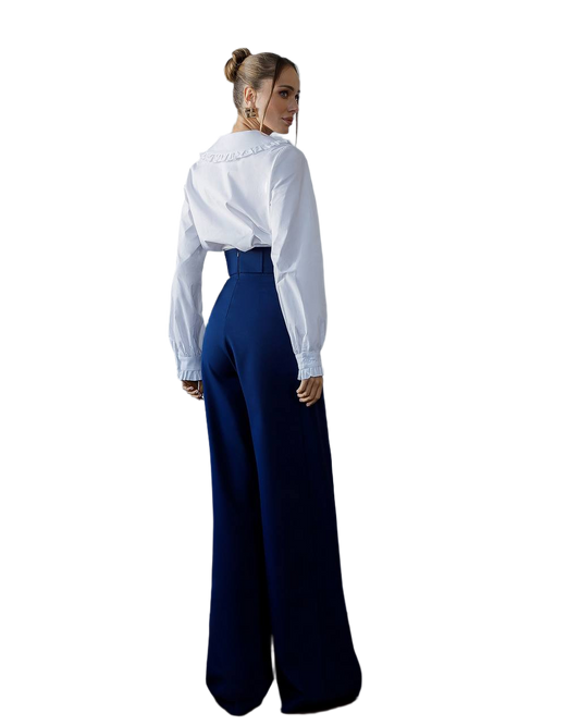 Person wearing a white blouse and blue high-waisted pants on a white background