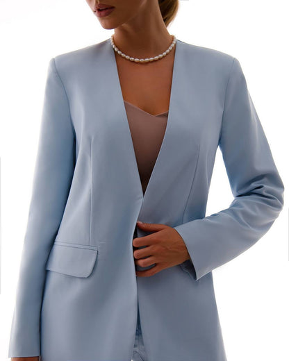 Light blue blazer worn by a person on a white background