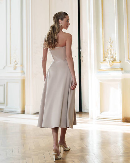 Elegant Beige Satin Dress with Corset and Flared Skirt for Parties or Weddings