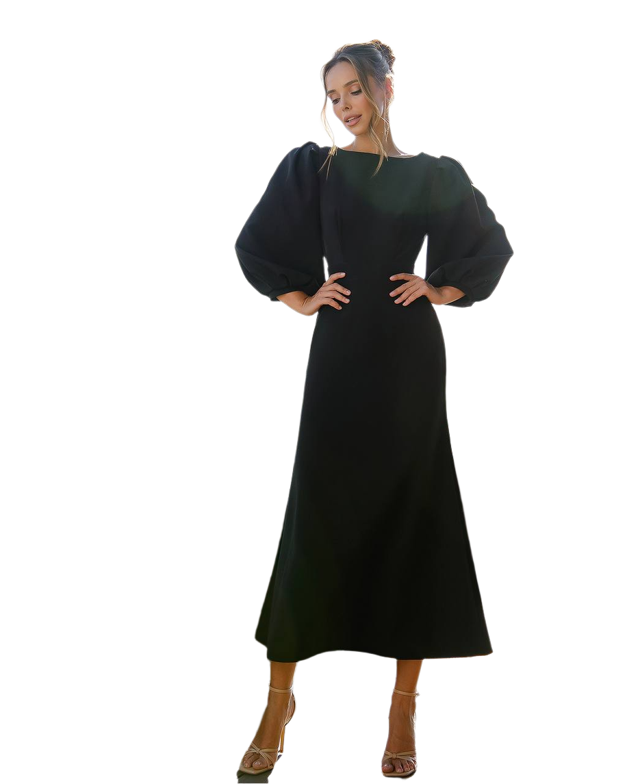 Woman wearing a black dress with puffed sleeves on a white background