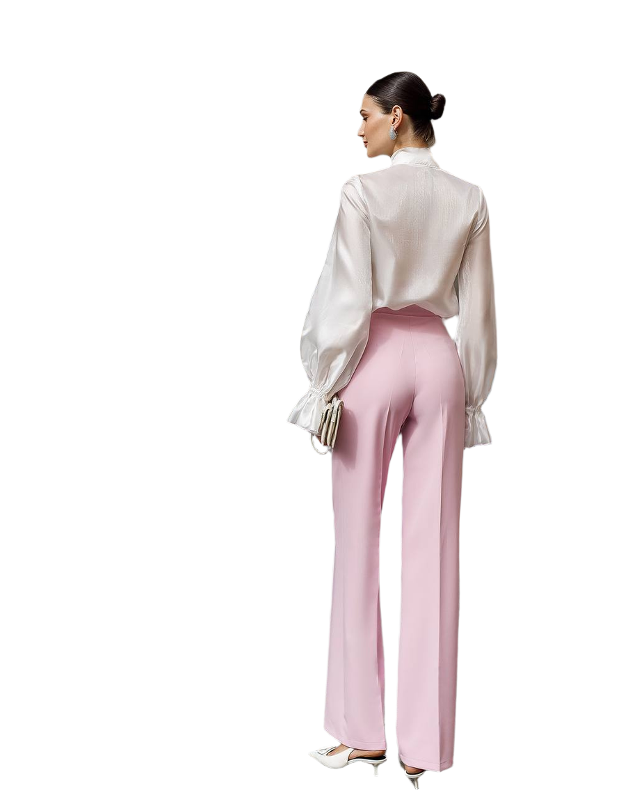 Woman wearing a white blouse and pink pants on a white background