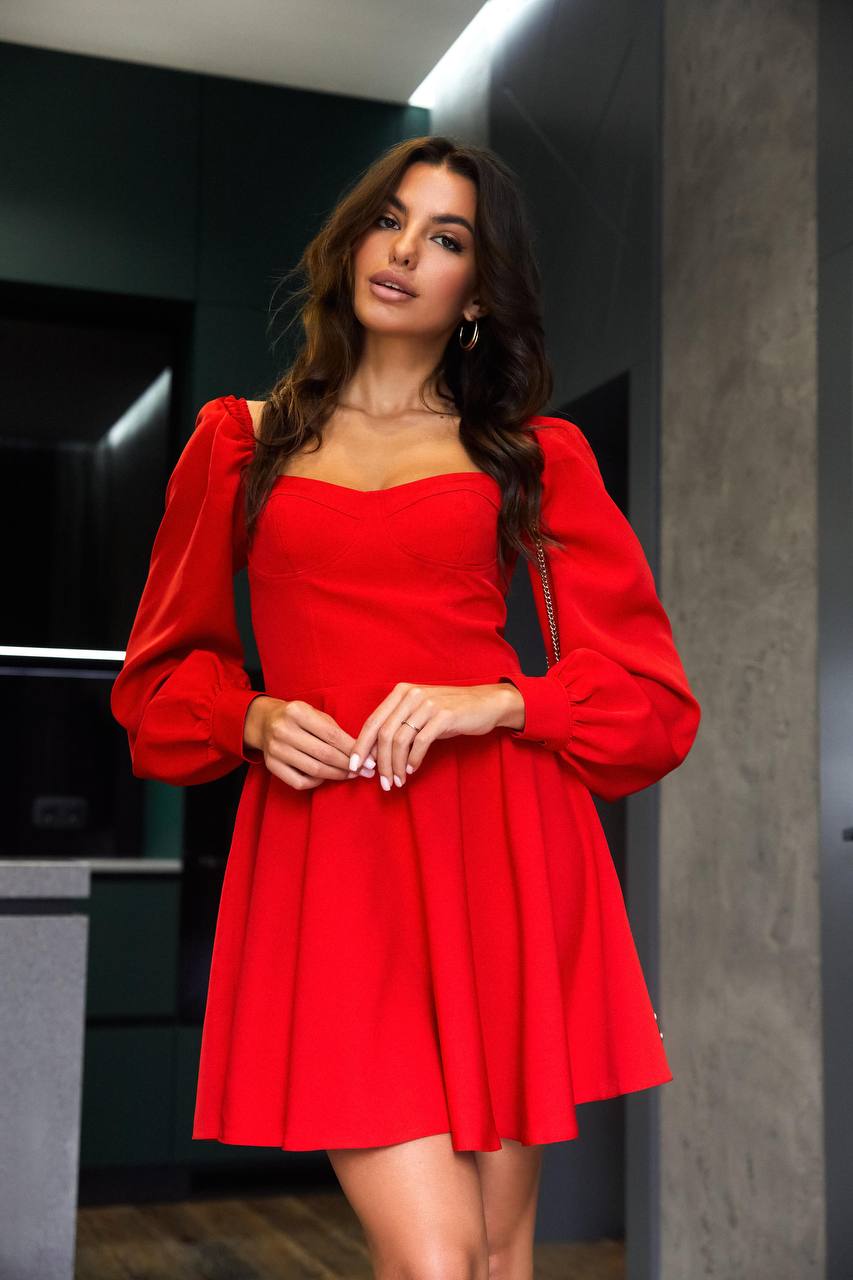Woman wearing a red dress in an indoor setting