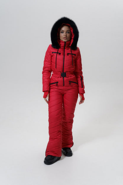 Person wearing a red winter suit with black fur hood on a white background