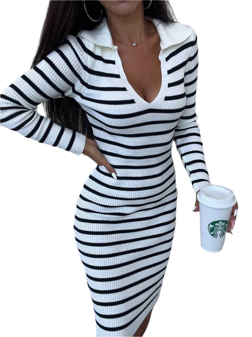 Person wearing a black and white striped dress holding a Starbucks cup on a white background