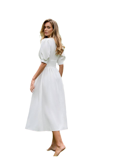 Woman wearing a white dress on a white background