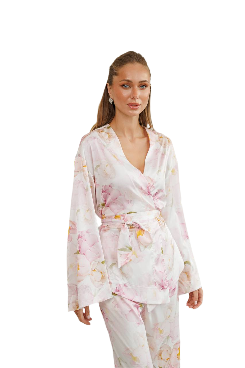 Woman wearing a floral robe on a white background