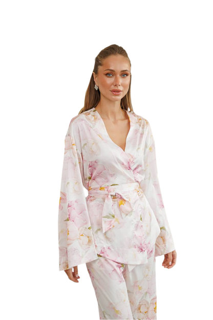 Woman wearing a floral robe on a white background