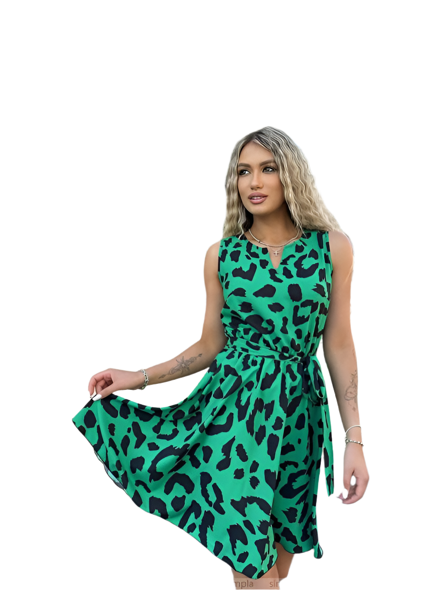 Woman wearing a green dress with black leopard print on a white background