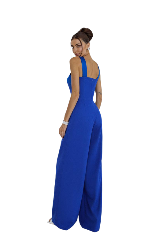 Woman wearing a blue jumpsuit on a white background