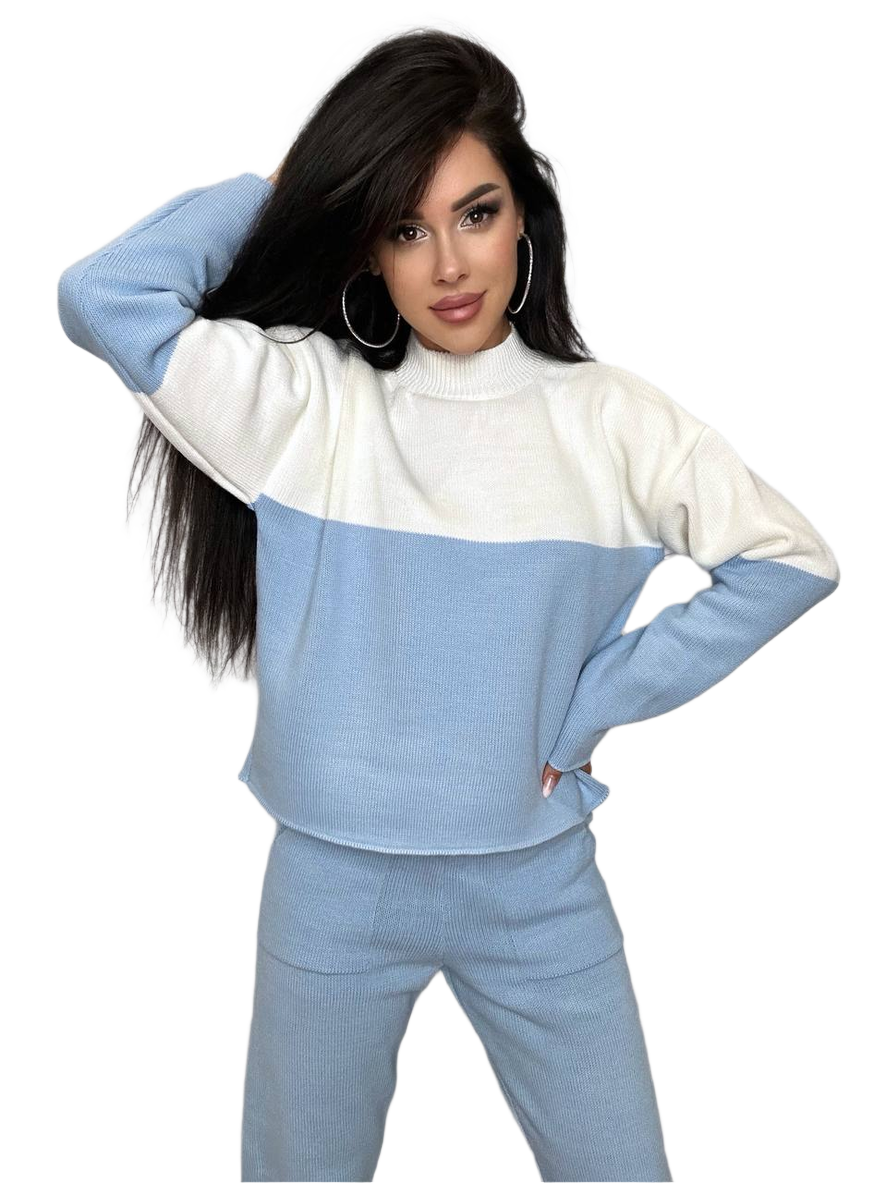 Woman wearing a blue and white color-blocked outfit on a white background