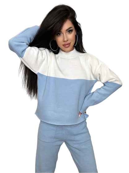 Woman wearing a blue and white color-blocked outfit on a white background