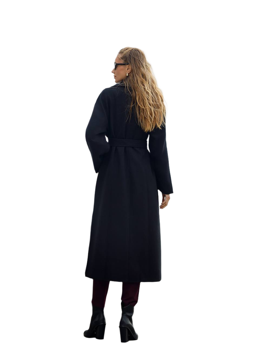 Person wearing a long black coat on a white background