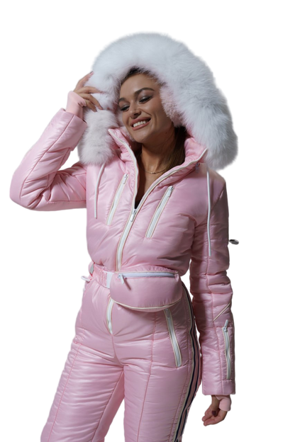 Woman wearing a pink snowsuit with a white fur hood on a white background