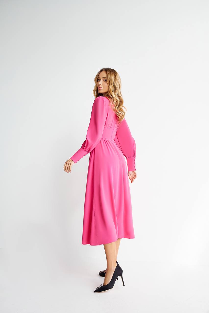 Woman wearing a pink dress on a white background