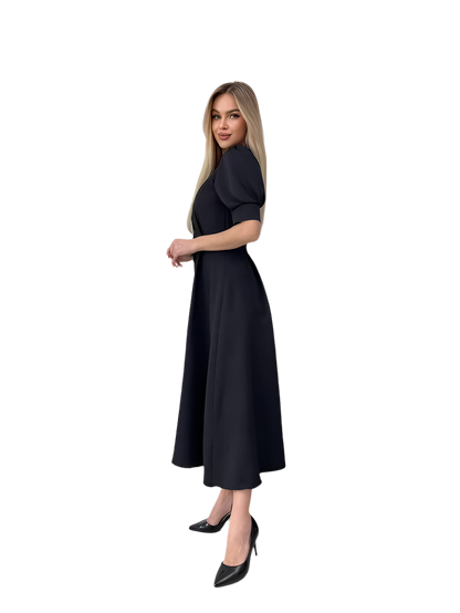 Woman wearing a black dress on a white background