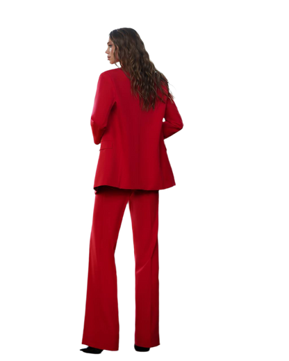 Woman wearing a red suit on a white background
