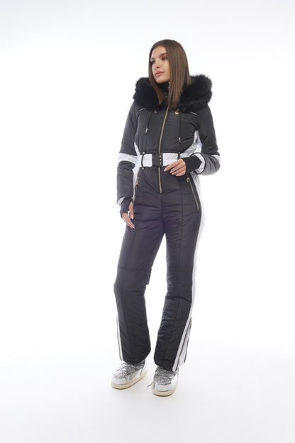 Person wearing a black and gray snowsuit with white accents on a white background