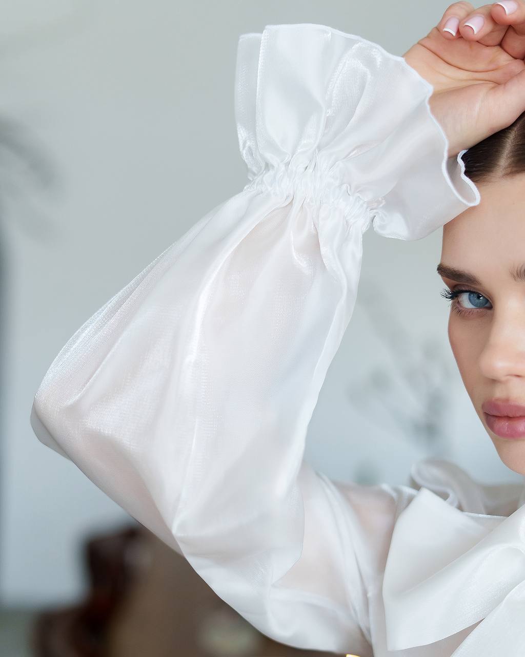 Woman wearing a white hijab with a blurred background