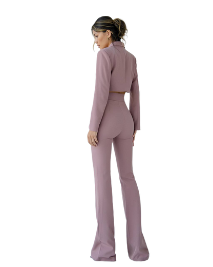 Woman wearing a mauve suit on a white background