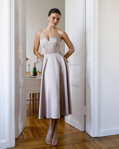 Elegant Beige Satin Dress with Corset and Flared Skirt for Parties or Weddings