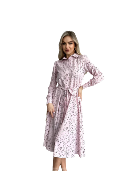 Woman wearing a pink floral dress on a white background