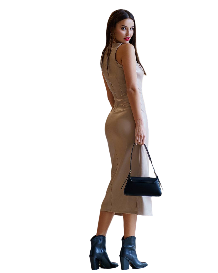 Woman wearing a beige dress and black boots, holding a black handbag on a white background