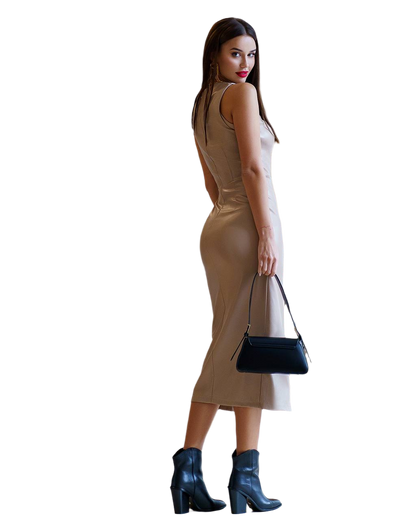 Woman wearing a beige dress and black boots, holding a black handbag on a white background