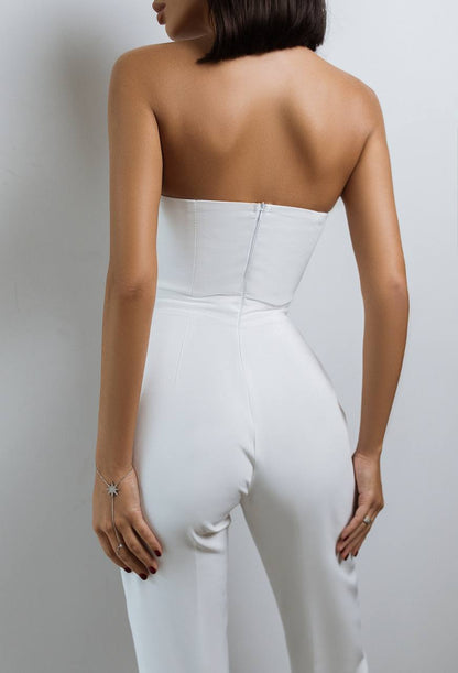 White strapless jumpsuit worn by a person on a plain background