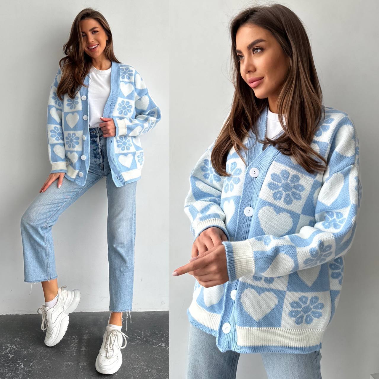 Woman wearing a blue and white patterned cardigan with jeans and white sneakers on a plain background.