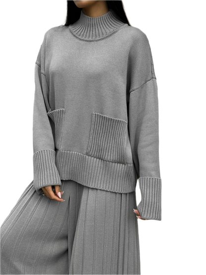 Gray ribbed sweater and pants set on a white background