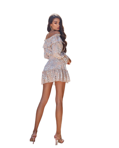 Woman wearing a floral off-shoulder dress on a white background