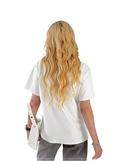 Person wearing a white shirt with long blonde hair on a white background