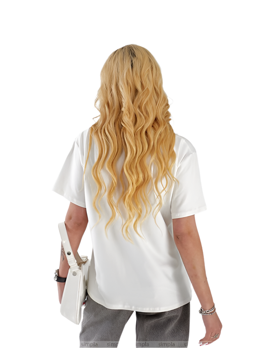 Person wearing a white shirt with long blonde hair on a white background