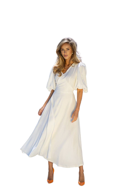 Woman wearing a white dress with blue accents on a white background