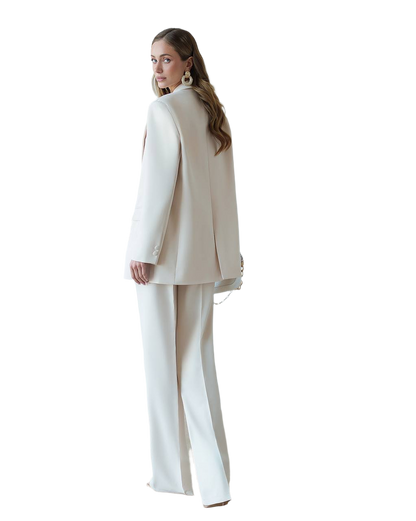 Woman wearing a beige suit on a white background