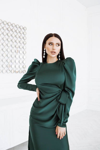 Woman wearing a green dress with a white background