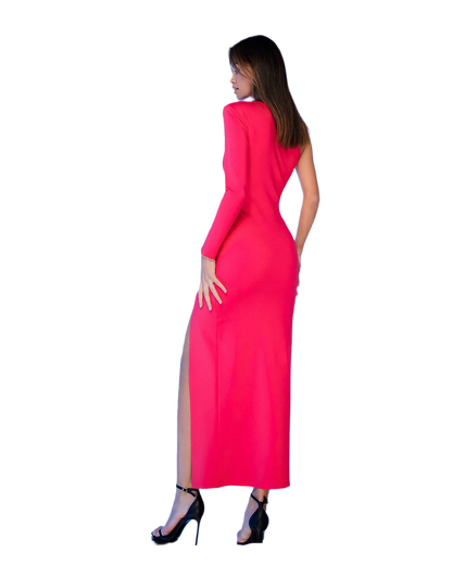 Woman wearing a bright pink dress with a side slit on a white background