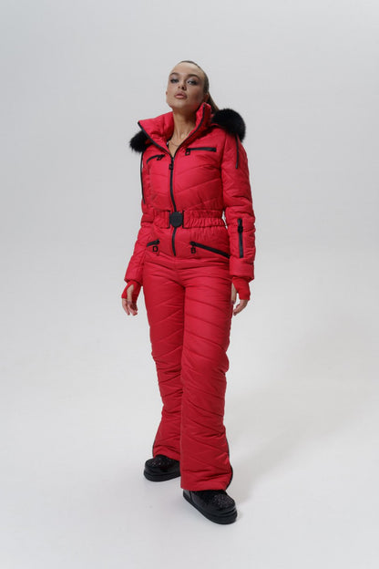 Person wearing a red snowsuit with black boots on a white background