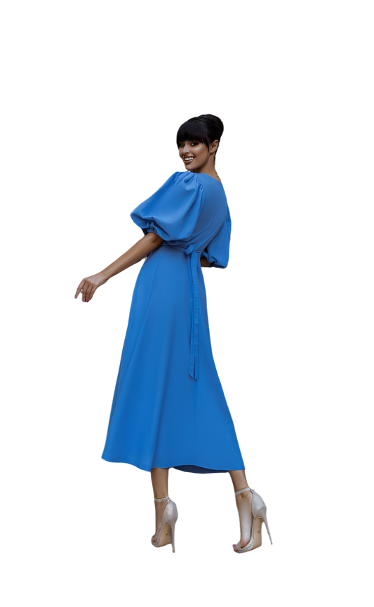 Woman wearing a blue dress on a white background