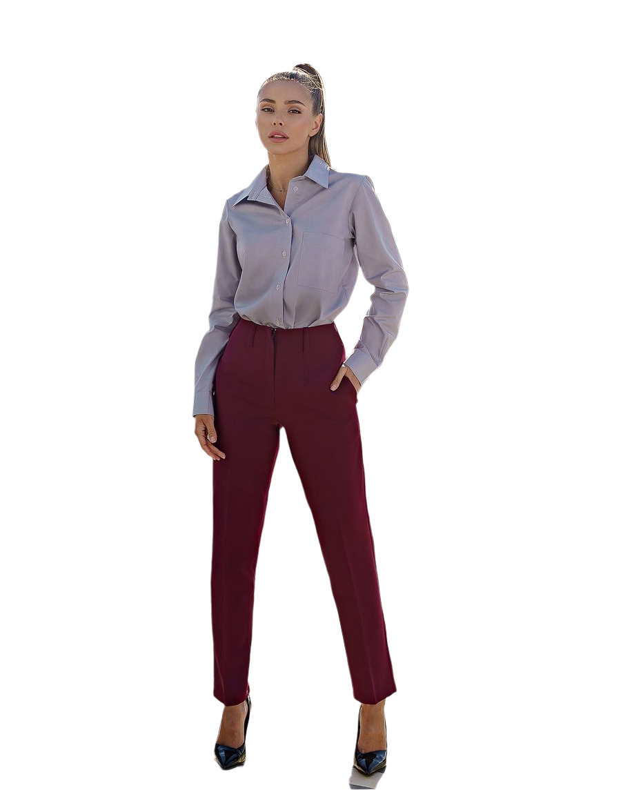 Woman wearing a light gray blouse and maroon pants on a white background
