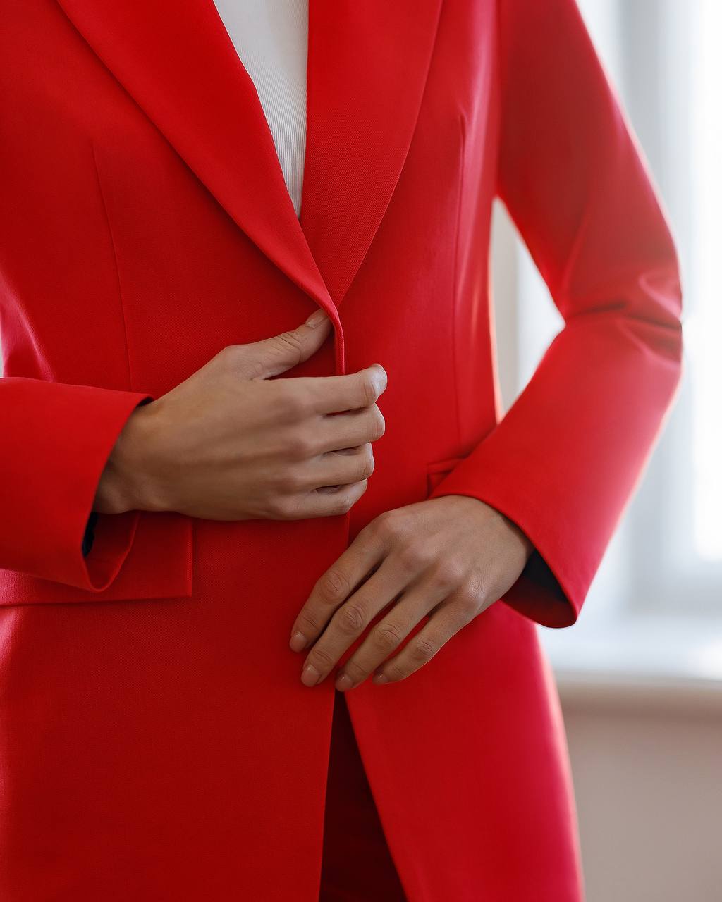 Red coat with a blurred background