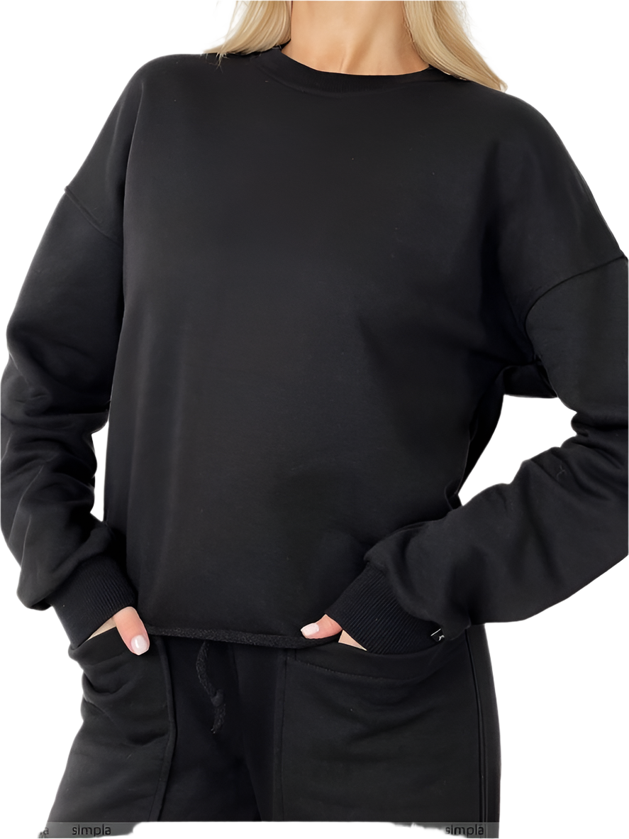 Person wearing a black sweatshirt and pants on a white background