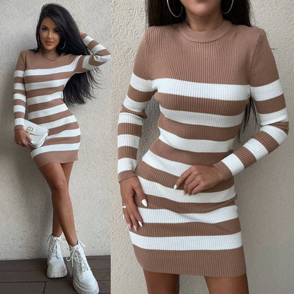 Woman wearing a brown and white striped dress against a neutral background