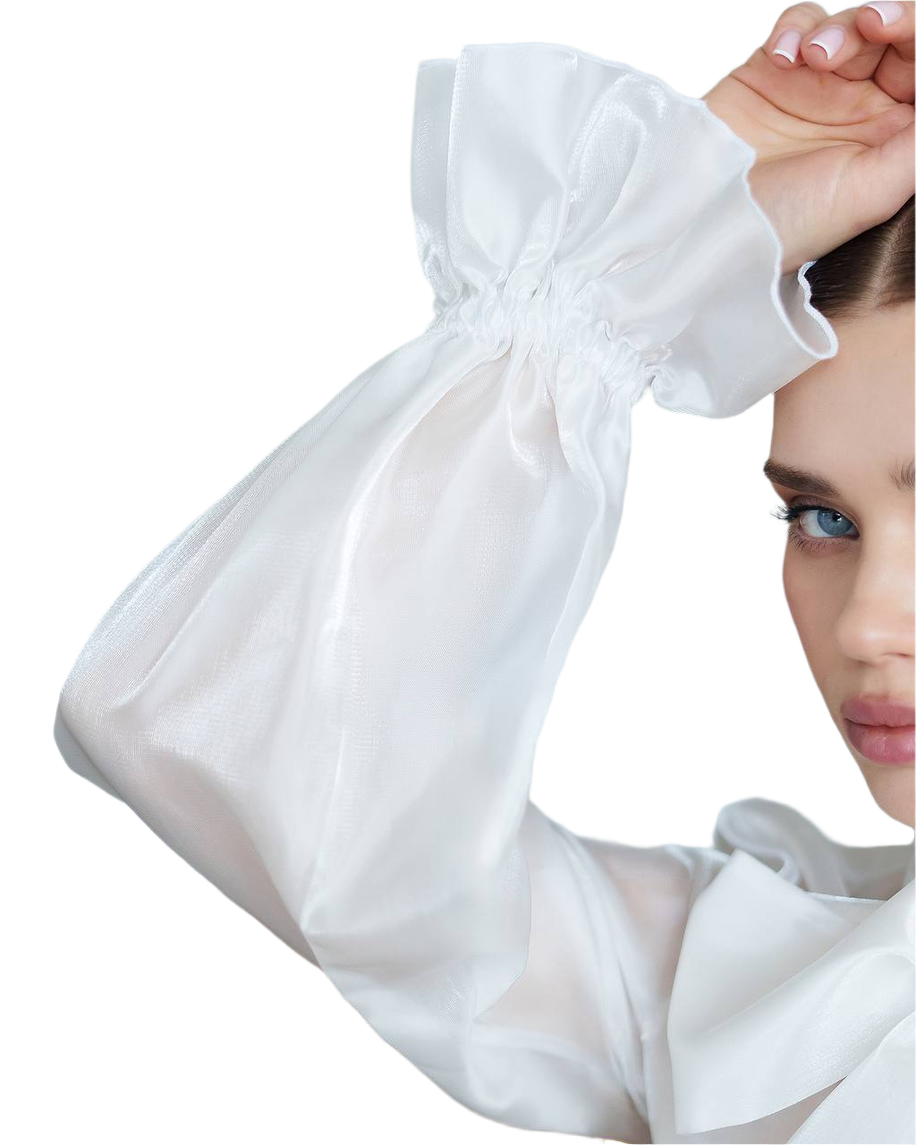 White arm sleeve being worn by a person on a white background