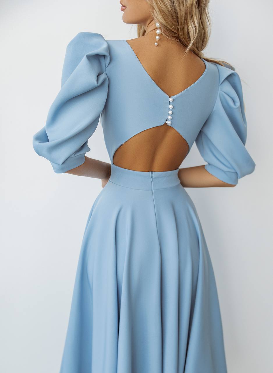 Light blue evening gown with puff sleeves on a white background