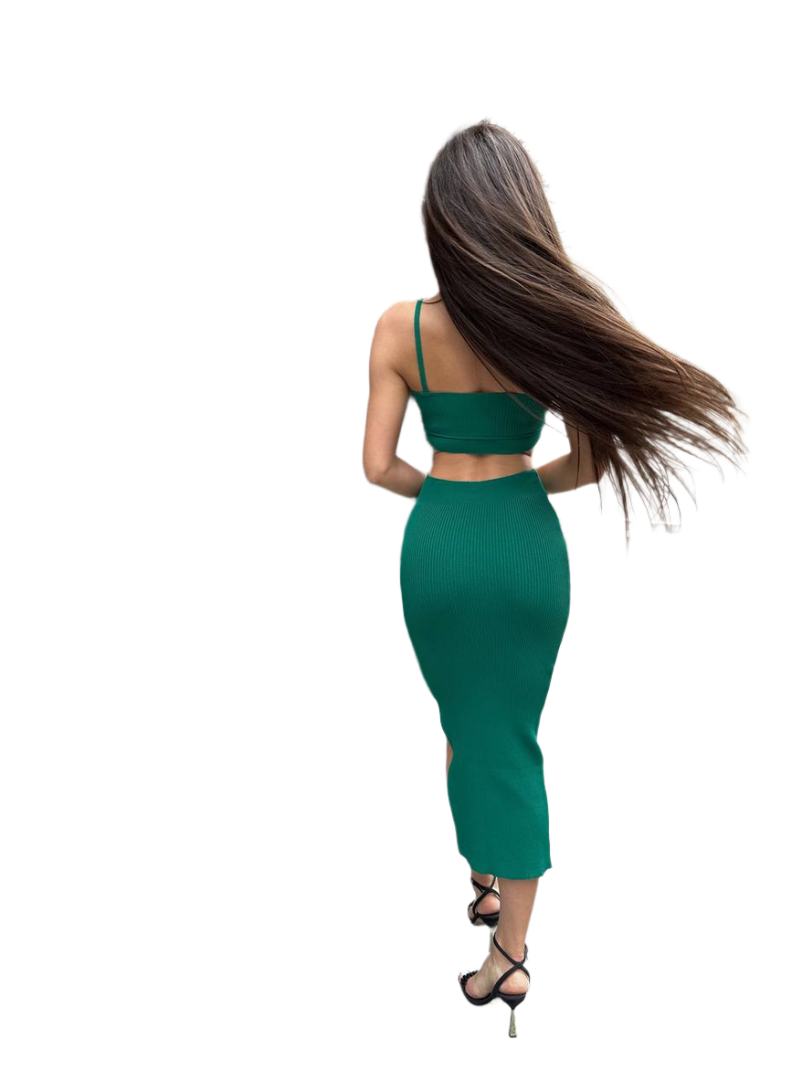 Woman in a green dress with long hair on a white background