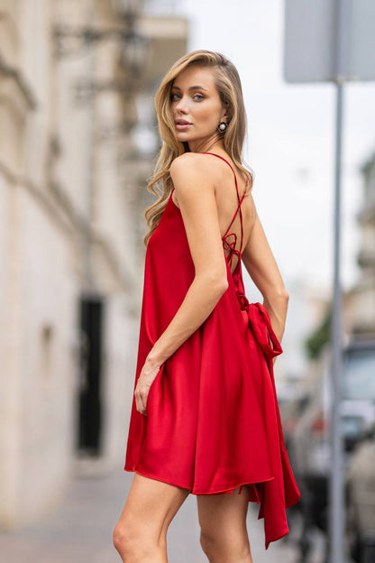 Woman wearing a red dress on a city street