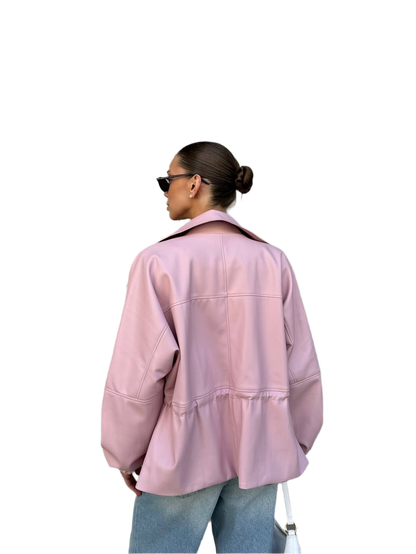 Person wearing a pink jacket and sunglasses on a white background