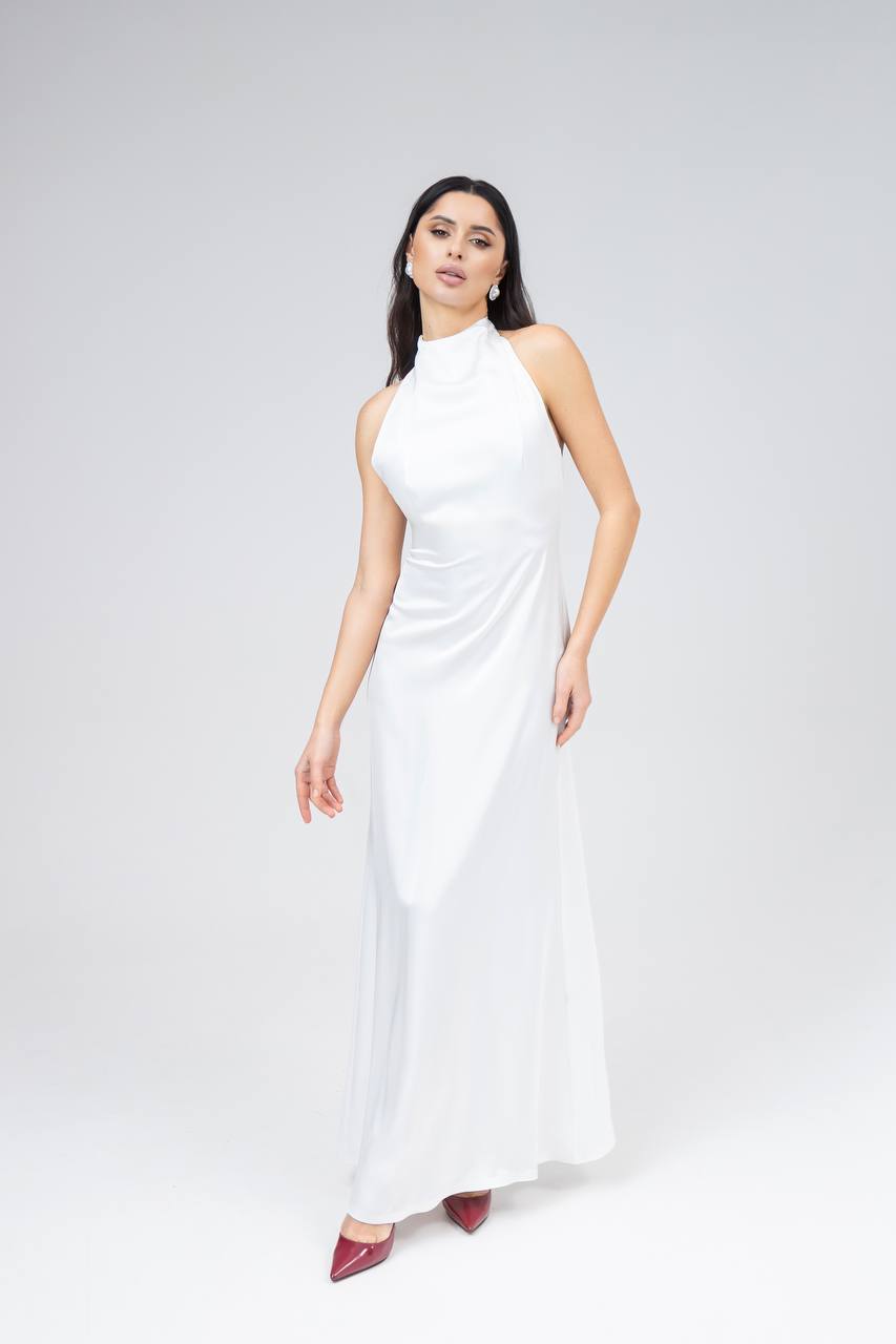 Woman wearing a white sleeveless dress on a white background