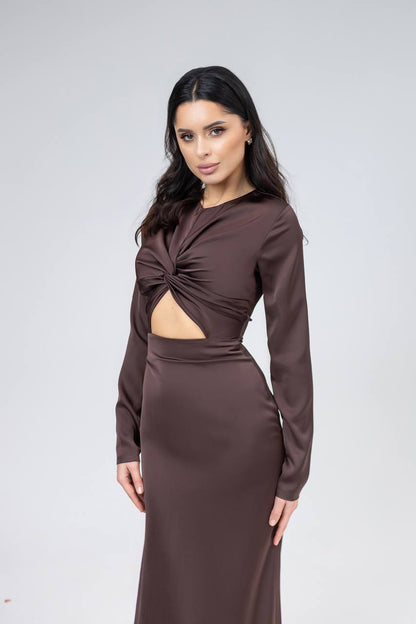 Woman wearing a brown dress with a cutout design on a white background